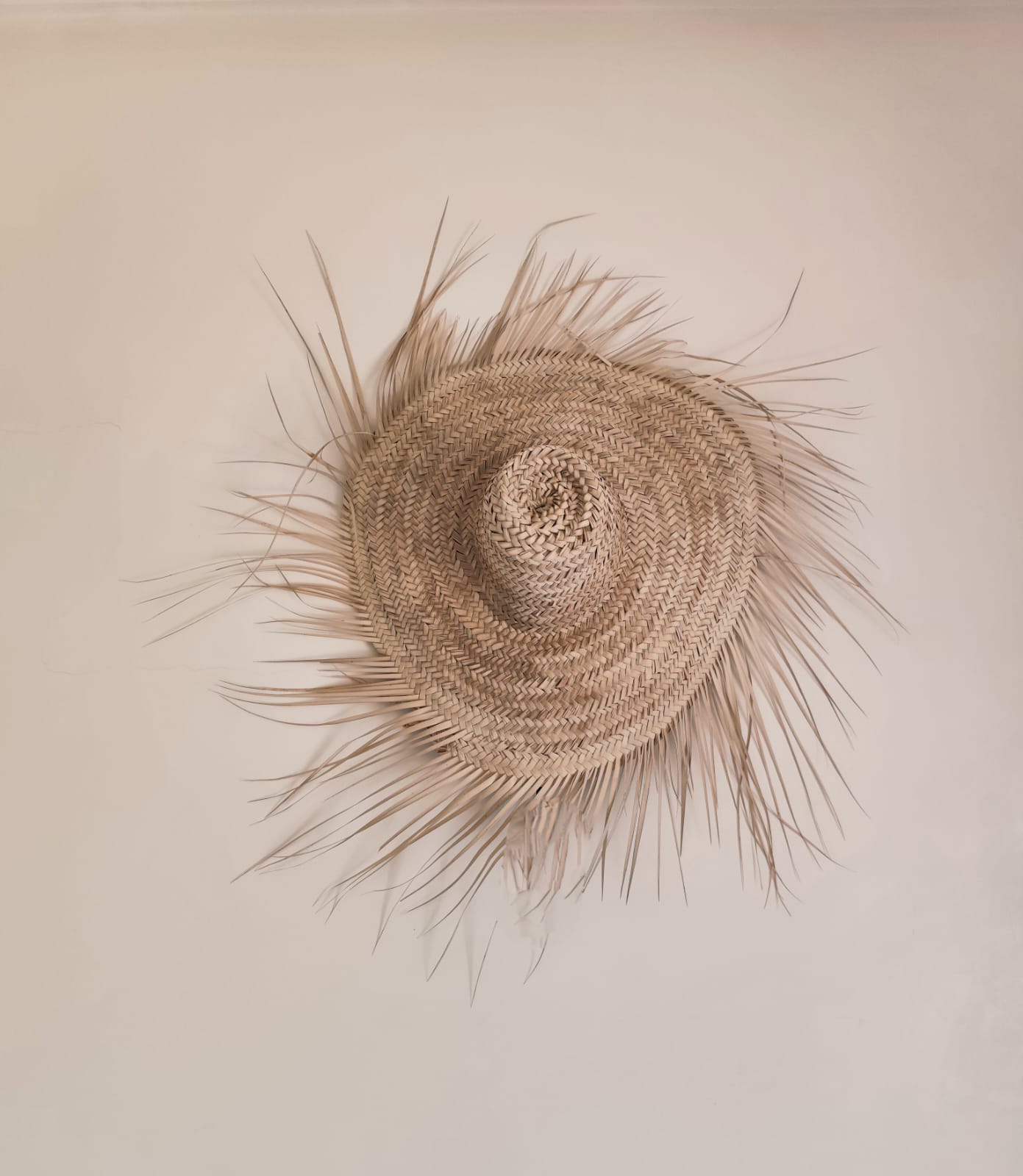 Chapeau mural en feuille de palmier