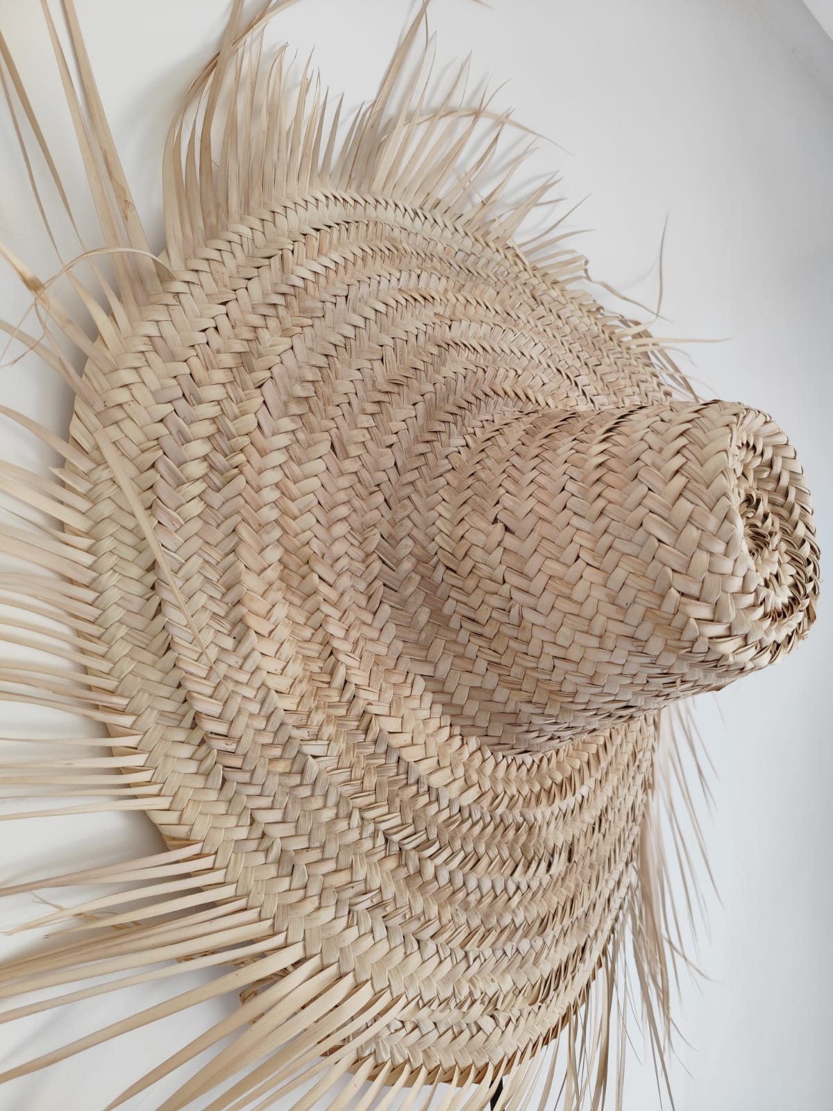 Chapeau mural en feuille de palmier